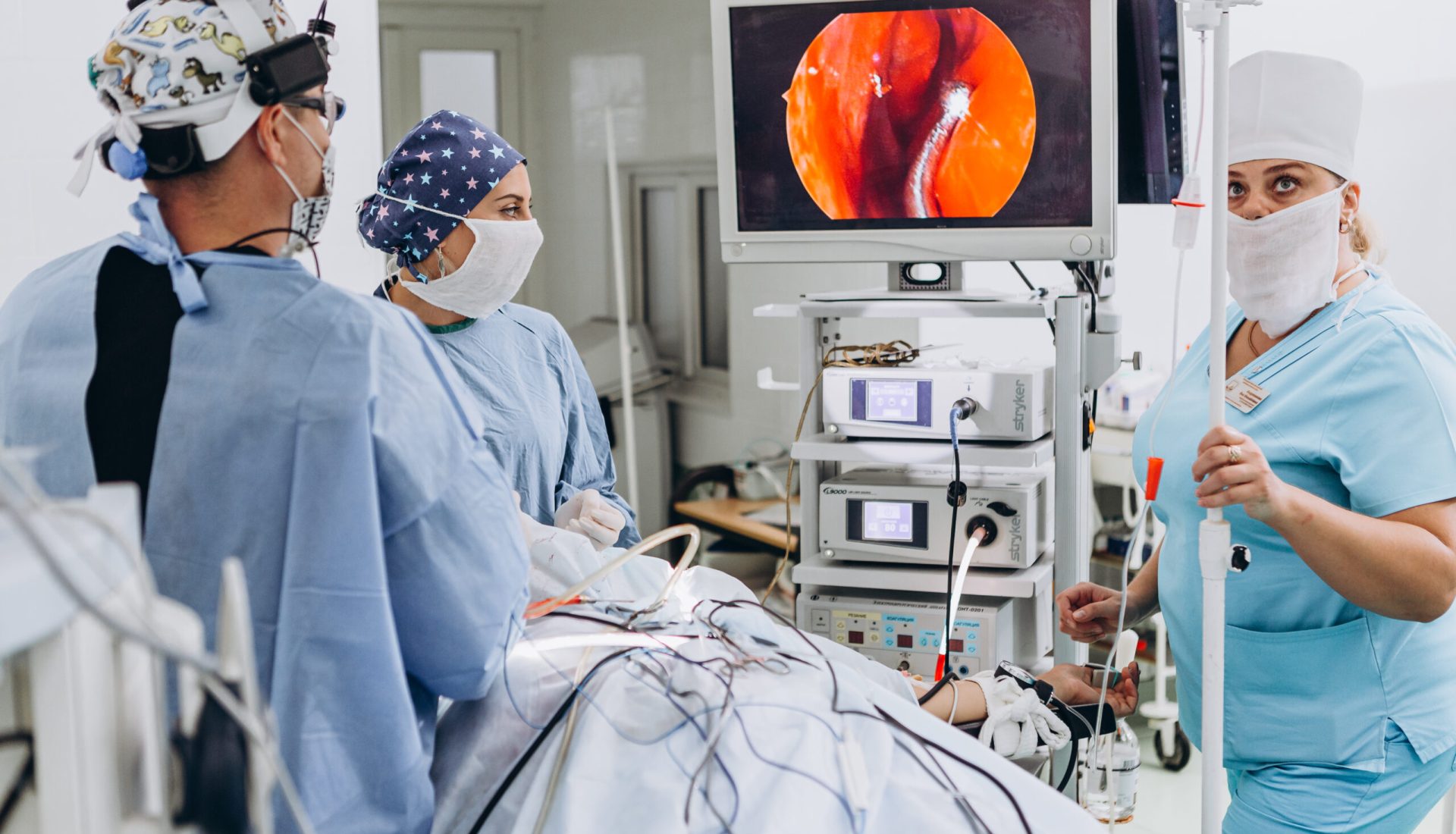 03.09.2019 Vinnitsa, Ukraine: Medical team performing surgery. Group of surgeons in hospital operation theater. Light room, selective focus