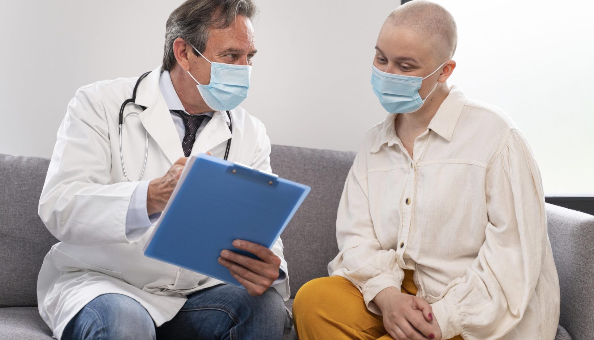 young-woman-suffering-breast-cancer-talking-with-her-doctor